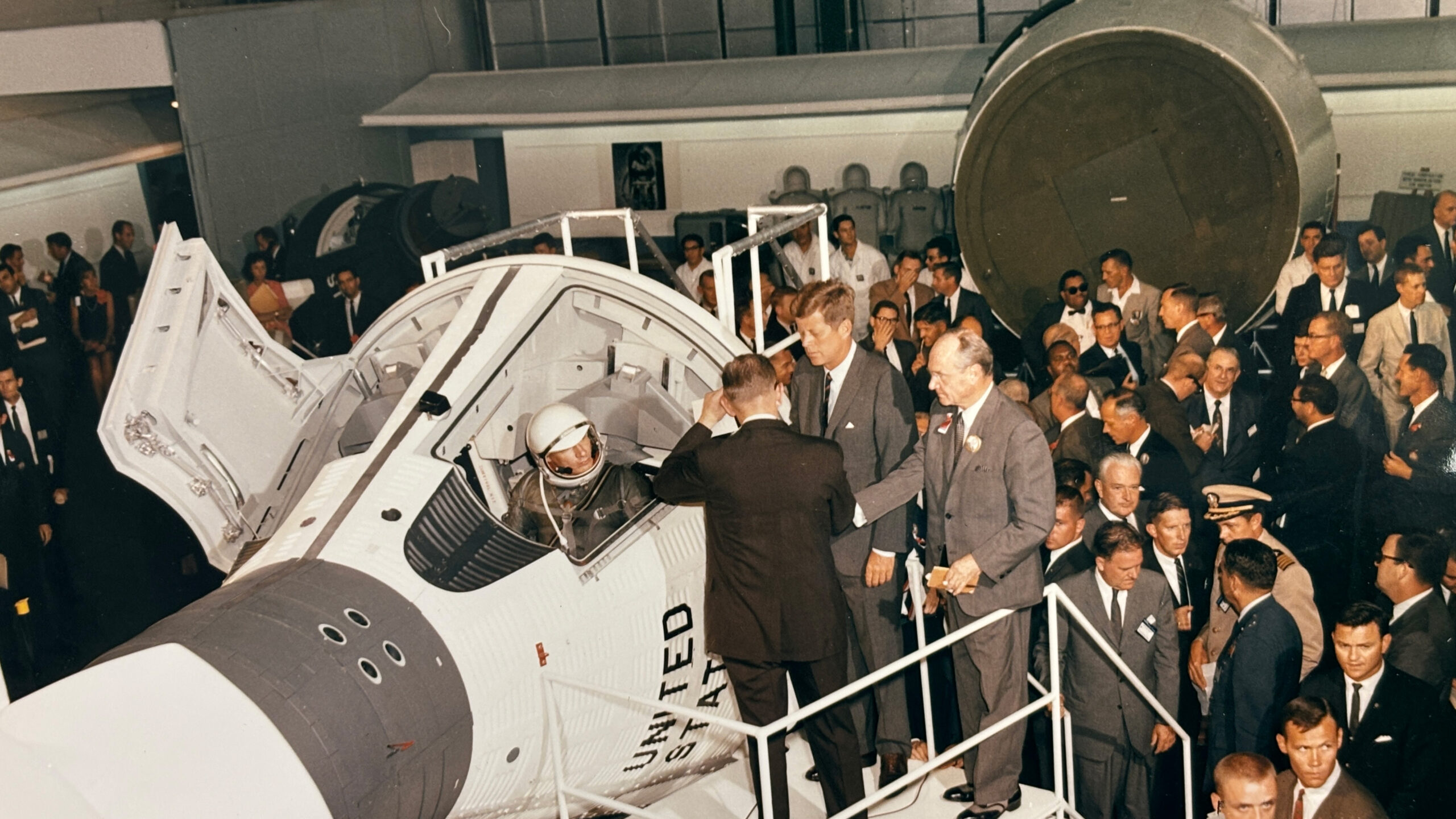 James S. McDonnell showing President John F. Kennedy a space capsule at McDonnell Douglas.