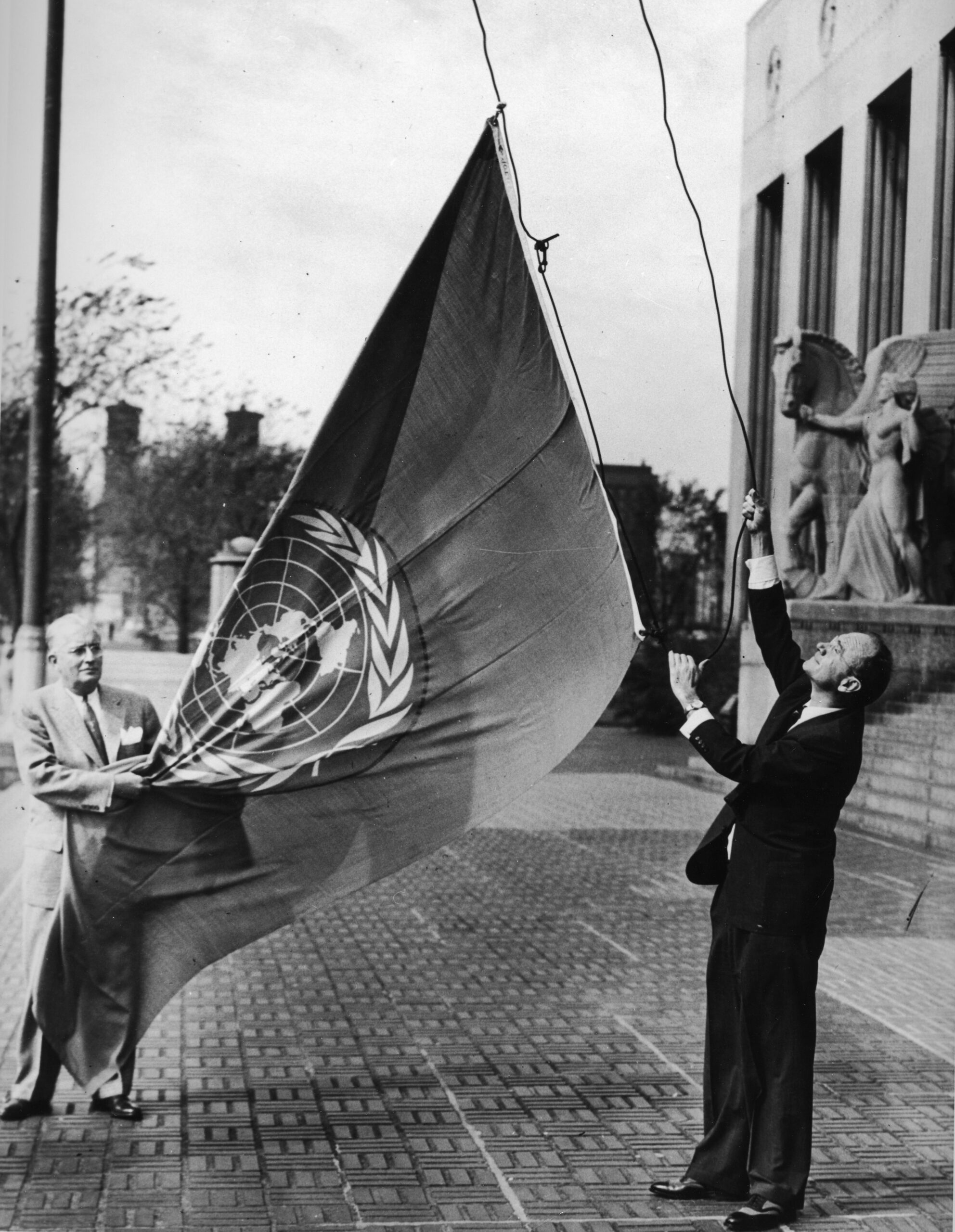 James S. McDonnell raising the United Nations flag at Soldiers Memorial.